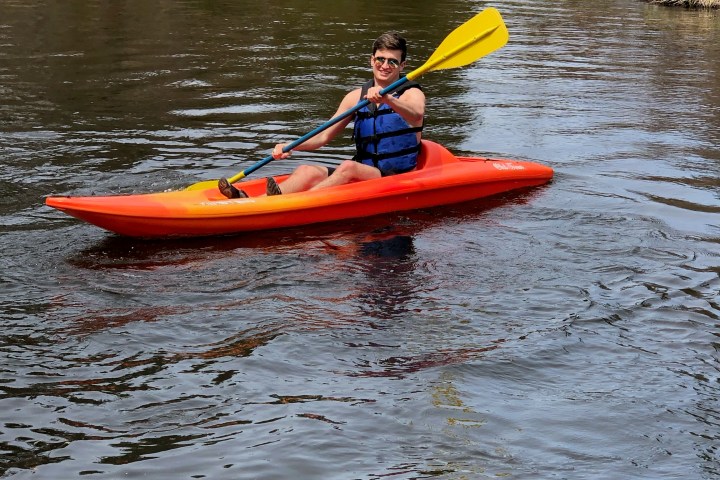 a person rowing a boat in a body of water