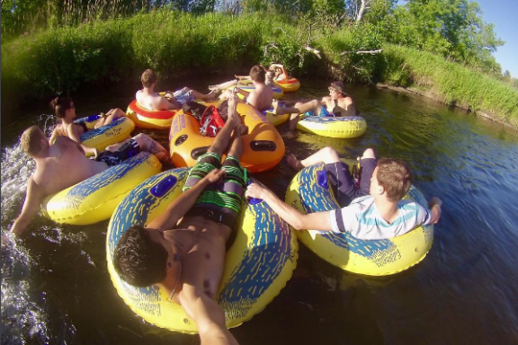 a group of people on a raft in the water