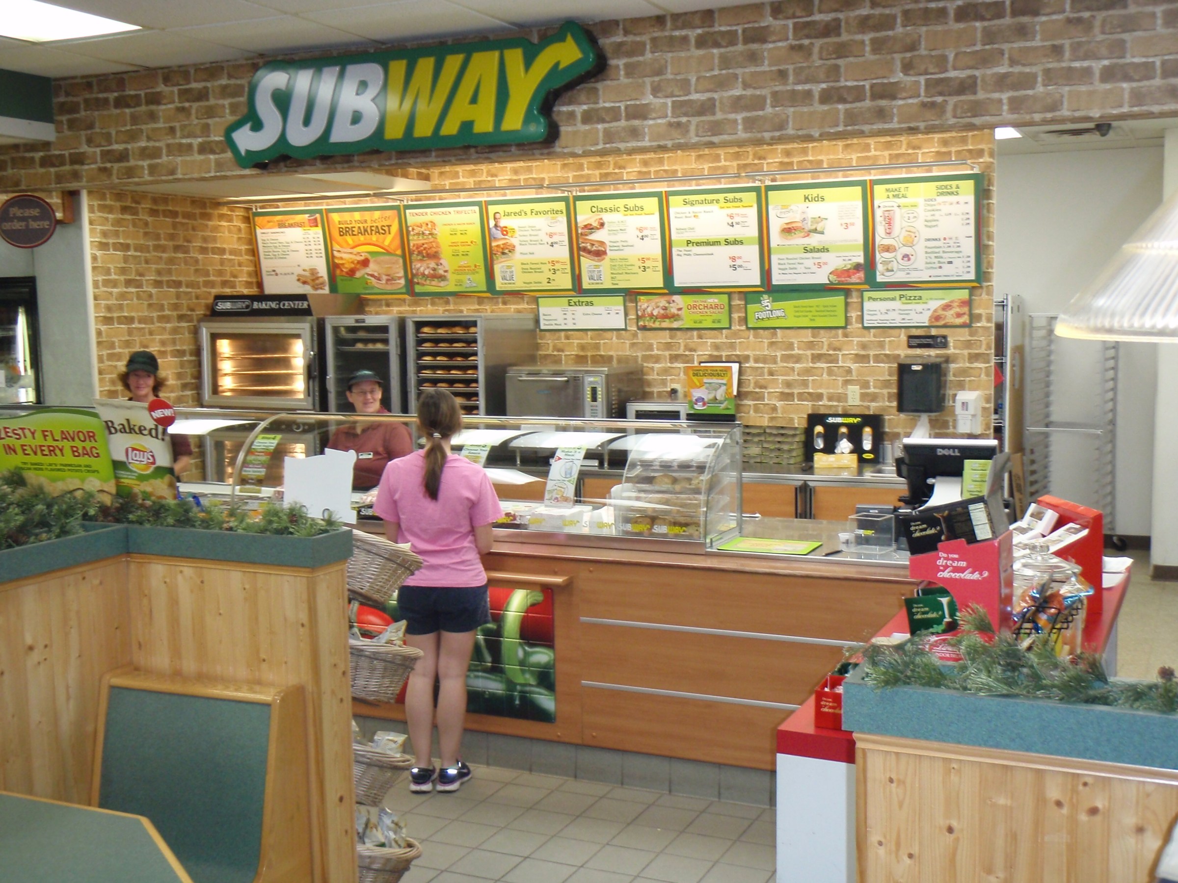 a person standing in front of a store