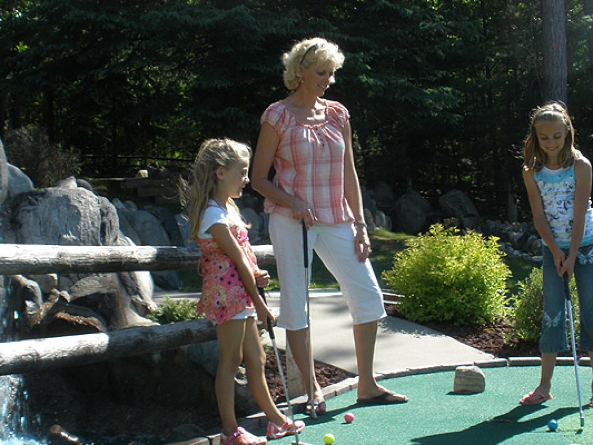 a group of people sitting at a zoo