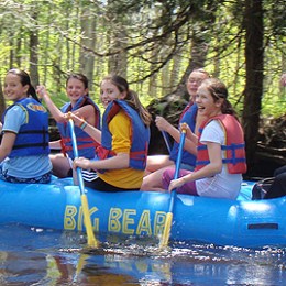 a group of people on a raft
