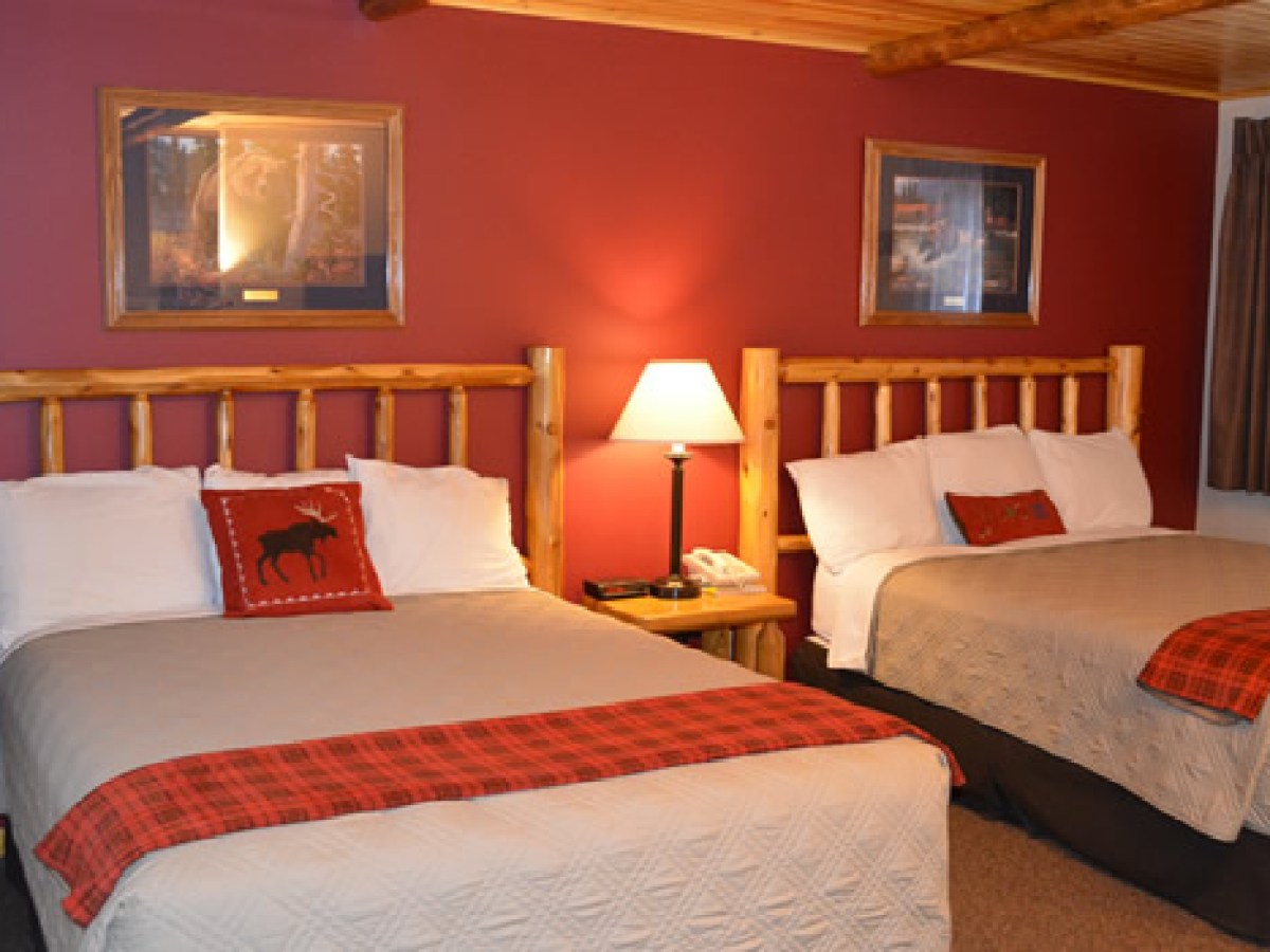 a bedroom with a large bed in a hotel room