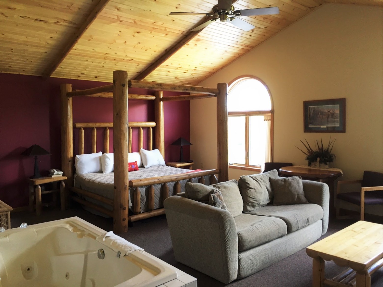 a living room filled with furniture and a large window