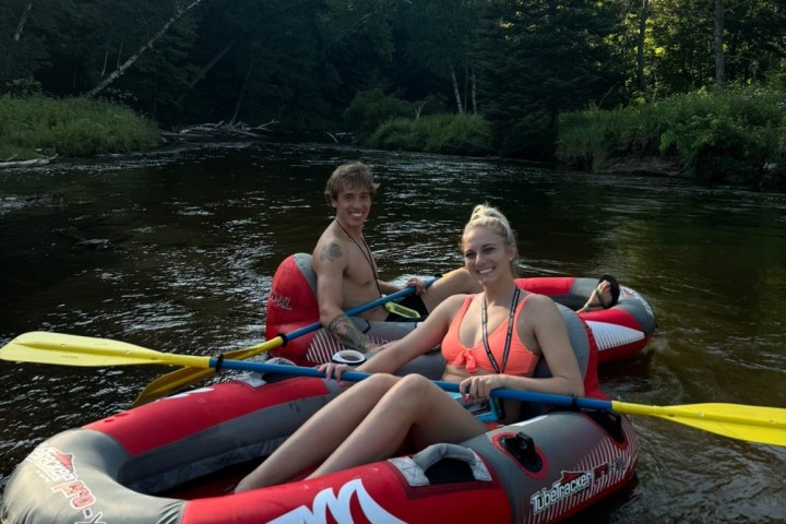 a group of people riding on the back of a boat